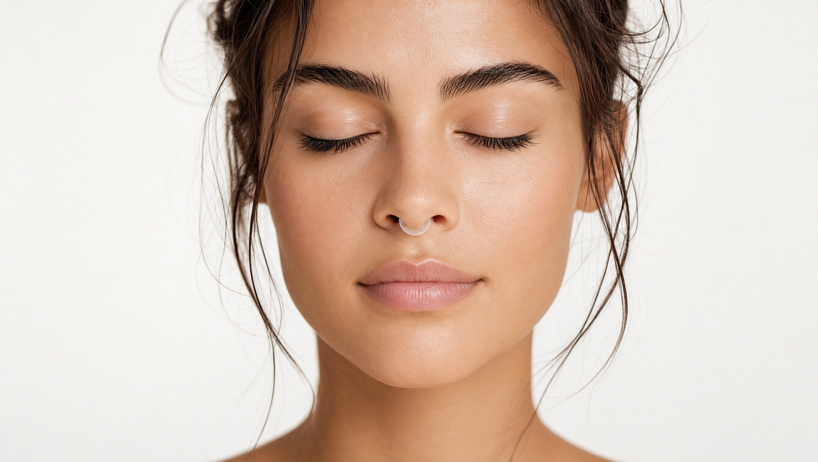 Woman Breathing the Auralis Nasal Diffuser Ring with eyes closed