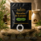 Auralis tea tree nasal diffuser ring and pouch on wet stone with tea tree sprigs 