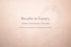 Auralis Breathe in Luxury wearable nasal aromatherapy brand statement on soft pink background