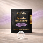 Lavender clear silicone wearable nasal aromatherapy ring displayed in front of Auralis Discovery Set pouch on wooden surface