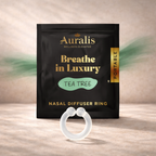 Tea tree clear silicone wearable nasal aromatherapy ring displayed in front of Auralis Discovery Set pouch on wooden surface