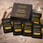 Auralis Essential Refill in Lemon featuring five identical scented pouches , Auralis box and clear silicone wearable nasal aromatherapy ring on neutral background