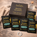 Auralis Essential Refill in Peppermint featuring five identical scented pouches, Auralis box and clear silicone wearable nasal aromatherapy ring on neutral background