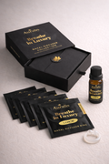 Auralis Signature Set in Lemon featuring essential oil bottle, five scented pouches, clear silicone wearable nasal aromatherapy ring, and packaging box