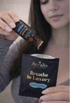 Woman adding aromatic oil drops into pouch with Auralis Ring to renew wearable nasal aromatherapy scent